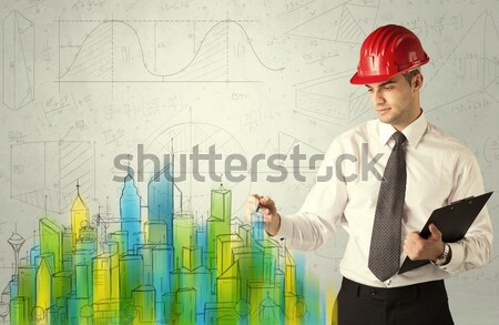 Stock photo: Business architect sketching a cityscape