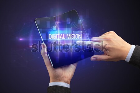 Hand with remote control and shining numbers Stock photo © ra2studio