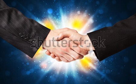 Dos hombres de negocios apretón de manos acuerdo explosión negocios Foto stock © ra2studio