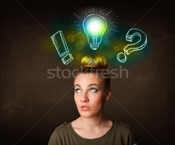 Stock photo: Young preety teenager with hand drawn light bulb illustration