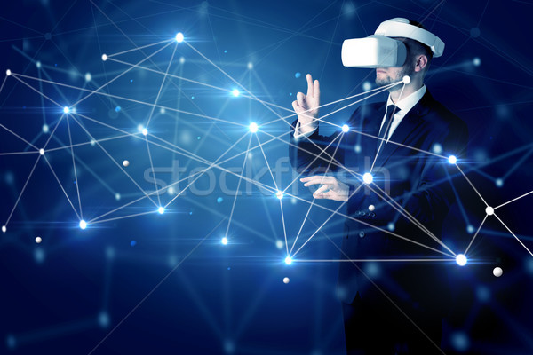 Stock photo: Man touching 3D connectivity and network signs