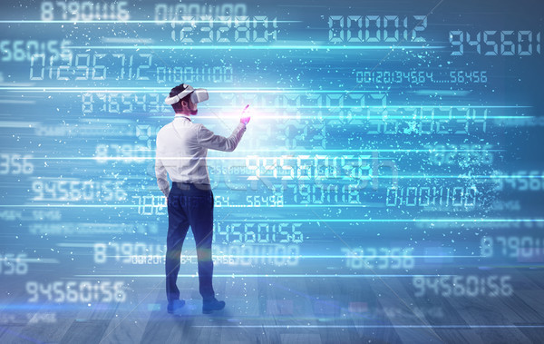 Businessman with variable numbers around Stock photo © ra2studio