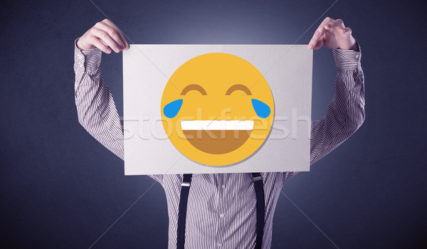 Geschäftsmann halten Papier lachen Emoticon jungen Stock foto © ra2studio