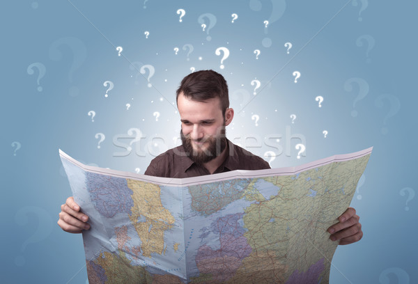 Young man holding map Stock photo © ra2studio