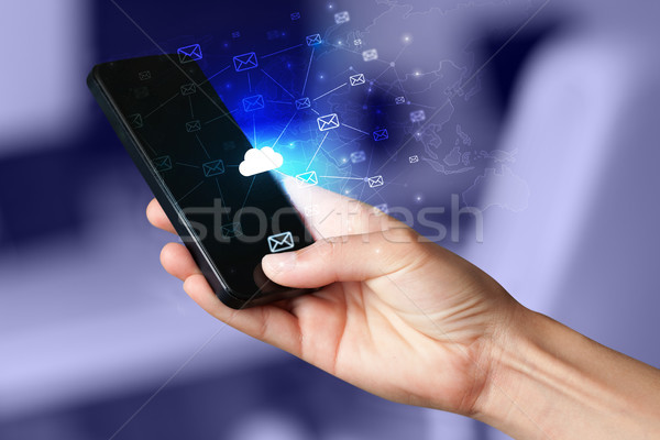 Hand using phone with centralized cloud computing system concept Stock photo © ra2studio
