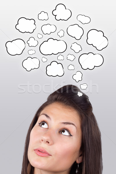 Fiatal lány gondolkodik felhők fej fehér üzlet Stock fotó © ra2studio