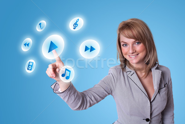 woman pressing media player button Stock photo © ra2studio
