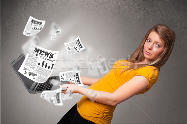 Casual pretty young woman holdin notebook and reading the explosive news Stock photo © ra2studio