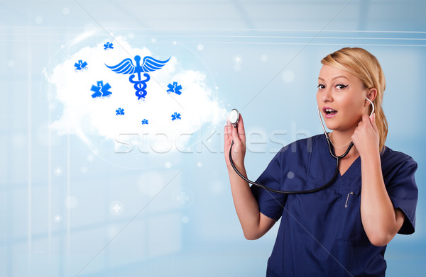 Young doctor with abstract cloud and medical icons Stock photo © ra2studio