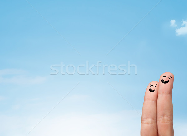 Szczęśliwy palce patrząc Błękitne niebo kopia przestrzeń Zdjęcia stock © ra2studio