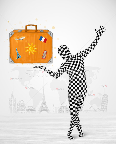 man in full body suit presenting vacation suitcase Stock photo © ra2studio