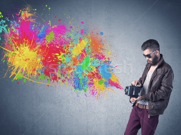 Hipster guy with camera and paint splash Stock photo © ra2studio