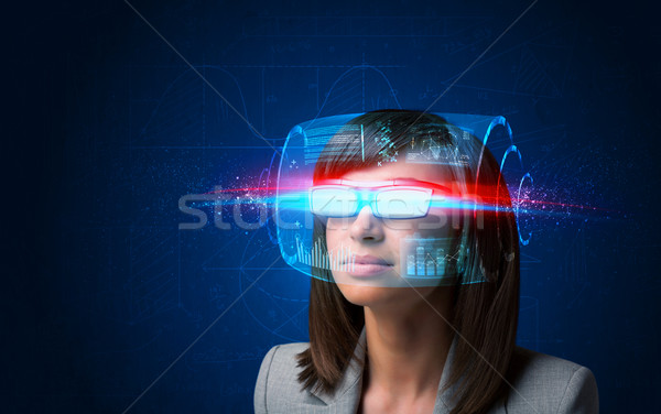 Stock photo: Future woman with high tech smart glasses 