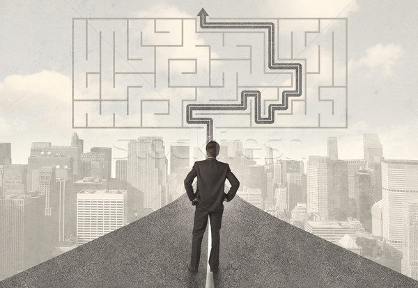 Businessman looking at road with maze and solution Stock photo © ra2studio