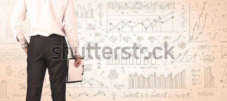 Empresario diagramas atrás negocios hombre Foto stock © ra2studio