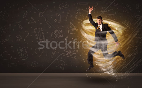 Happy businessman jumping in tornado concept Stock photo © ra2studio