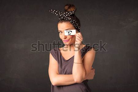 Silly youngster looking with hand drawn eye paper Stock photo © ra2studio