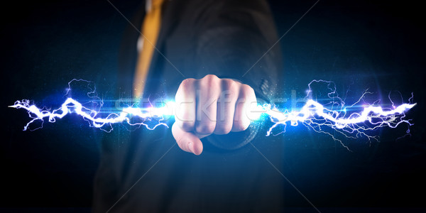 Człowiek biznesu elektrycznej świetle ręce Zdjęcia stock © ra2studio