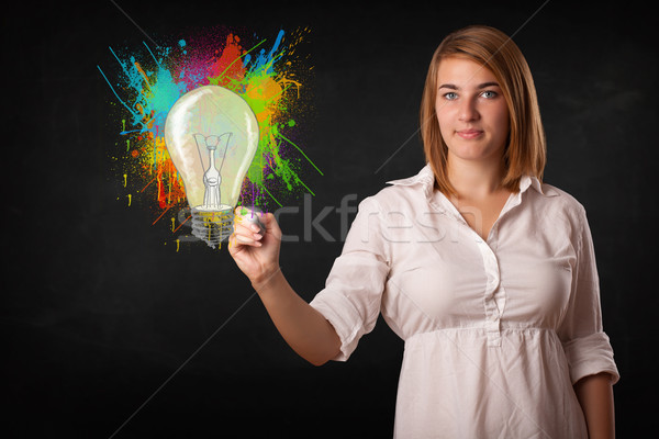 年輕 女士 畫 燈泡 飛濺 商業照片 © ra2studio