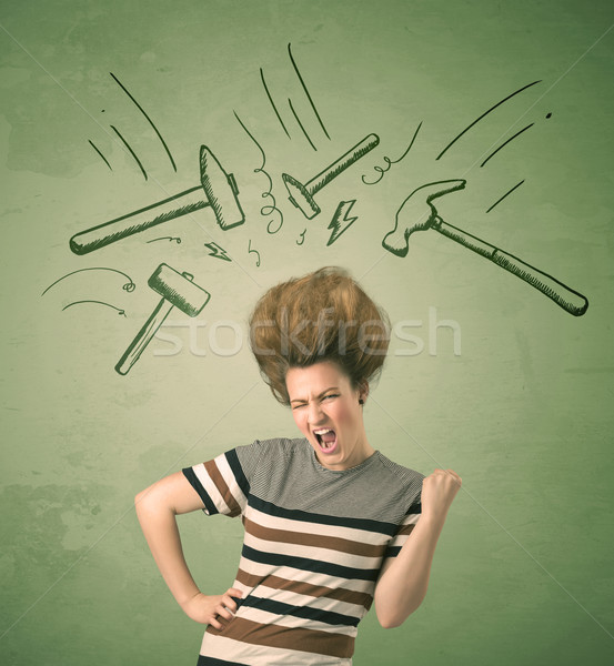 Stock photo: Tired woman with hair style and headache hammer symbols 