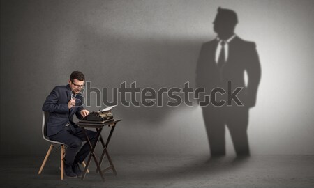 Shadow threatening hard worker man Stock photo © ra2studio