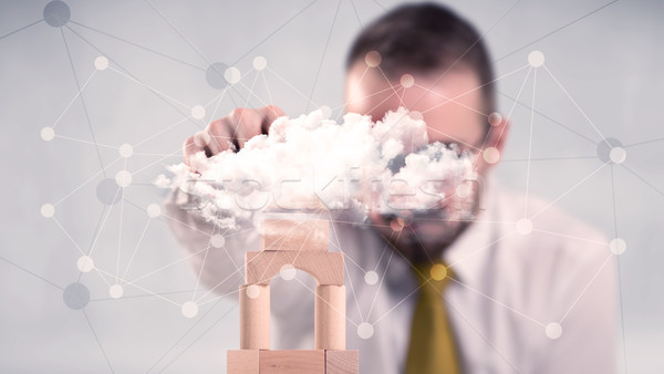 Businessman building a tower Stock photo © ra2studio