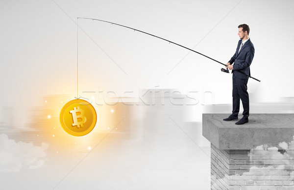 Businessman fishing coins concept Stock photo © ra2studio