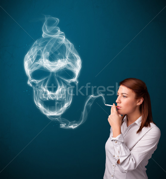 年輕女子 抽煙 香煙 有毒的 頭骨 商業照片 © ra2studio