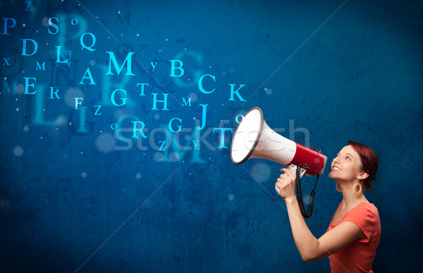 Stock photo: Young girl shouting into megaphone and text come out