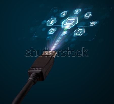 Electric cable with multimedia icons Stock photo © ra2studio