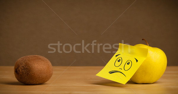 Apple with sticky post-it note looking sadly at kiwi Stock photo © ra2studio