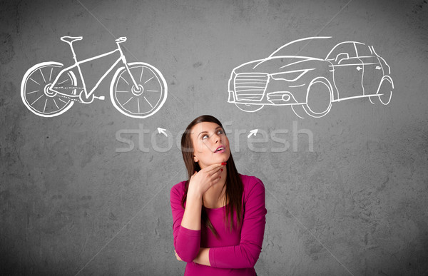 Woman making a choice between bicycle and car Stock photo © ra2studio