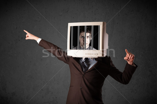 Business man with monitor on his head traped into a digital syst Stock photo © ra2studio