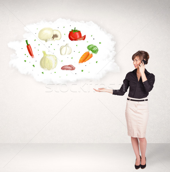 Young girl presenting nutritional cloud with vegetables  Stock photo © ra2studio
