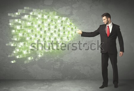 Young business person throwing money concept Stock photo © ra2studio