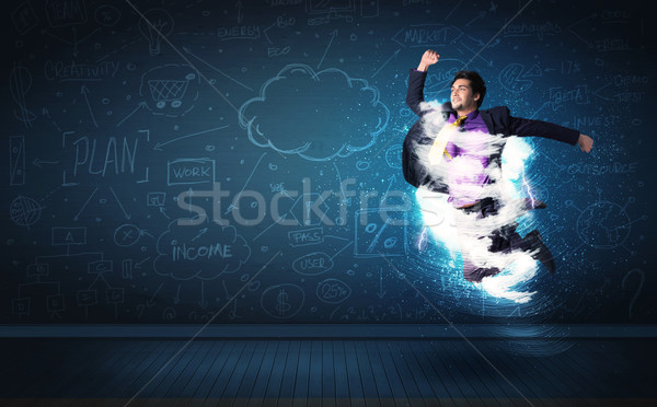 Heureux homme d'affaires sautant tempête nuage autour [[stock_photo]] © ra2studio