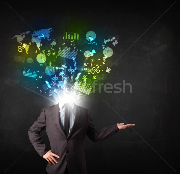 Stock photo: Business man in suit with graph and charts exploding from his bo