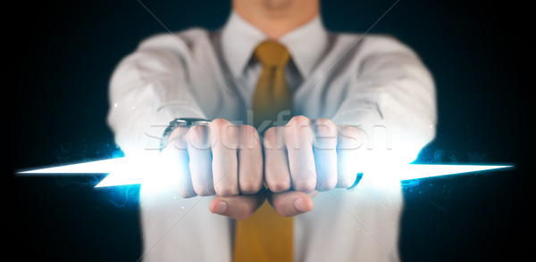 Geschäftsmann halten glühend Blitz Hände Feuer Stock foto © ra2studio