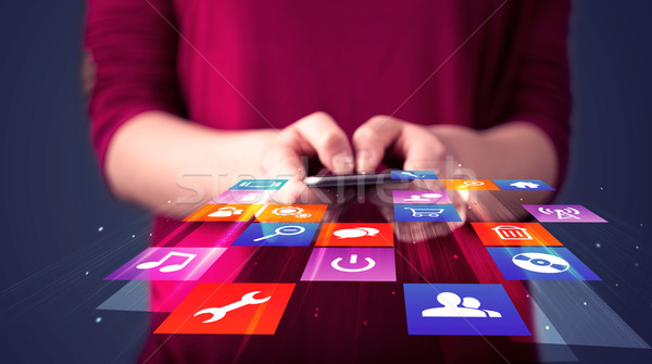 Nő tart okostelefon színes alkalmazás ikonok Stock fotó © ra2studio