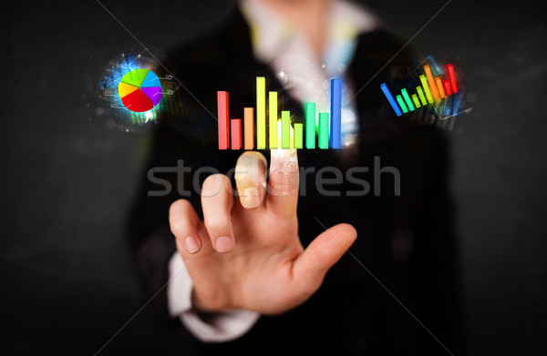 Stock photo: Young businesswoman touching colorful modern graph system concep