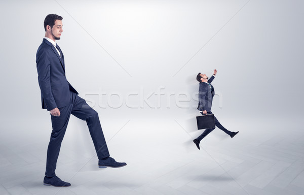 Small man fired by boss with white wallpaper Stock photo © ra2studio