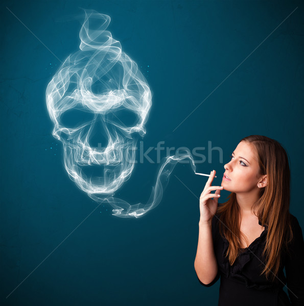 Jeune femme fumer dangereux cigarette toxique crâne Photo stock © ra2studio