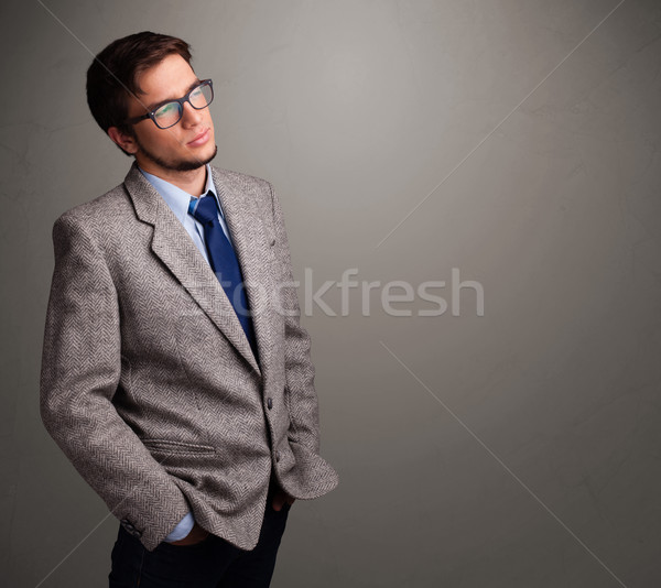 Young man thinking with empty copy space Stock photo © ra2studio