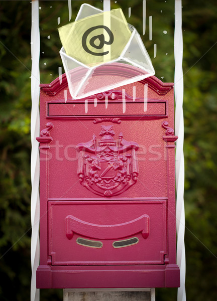 Envelope with email sign dropping into mailbox Stock photo © ra2studio