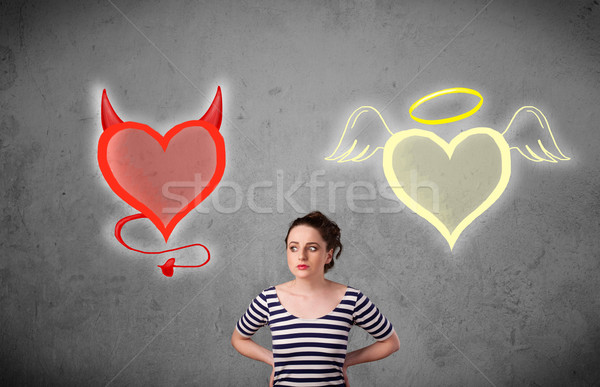 Nő áll angyal ördög szívek csinos Stock fotó © ra2studio