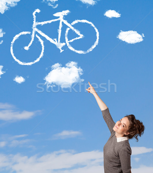 Joven mirando bicicleta nubes cielo azul jóvenes Foto stock © ra2studio