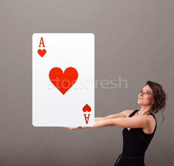 Beautifu woman holding a red heart ace Stock photo © ra2studio