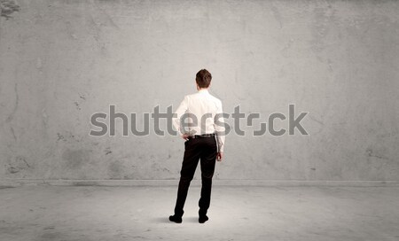 Stock photo: Young businessman standing confused