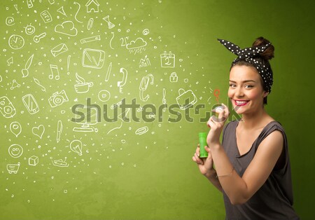 Beautiful woman blowing soap bubble on copyspace background Stock photo © ra2studio