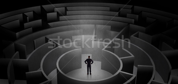 Businessman choosing between entrances in a middle of a dark maze Stock photo © ra2studio
